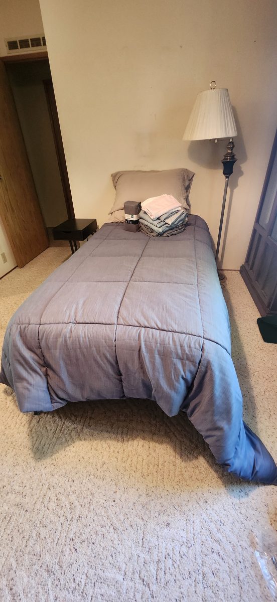 Twin Bed, bedding, lamp & side table